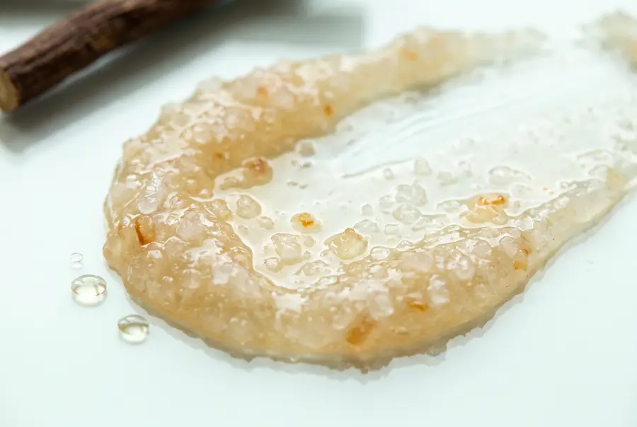Close-up of licorice and niacinamide salt scrub texture