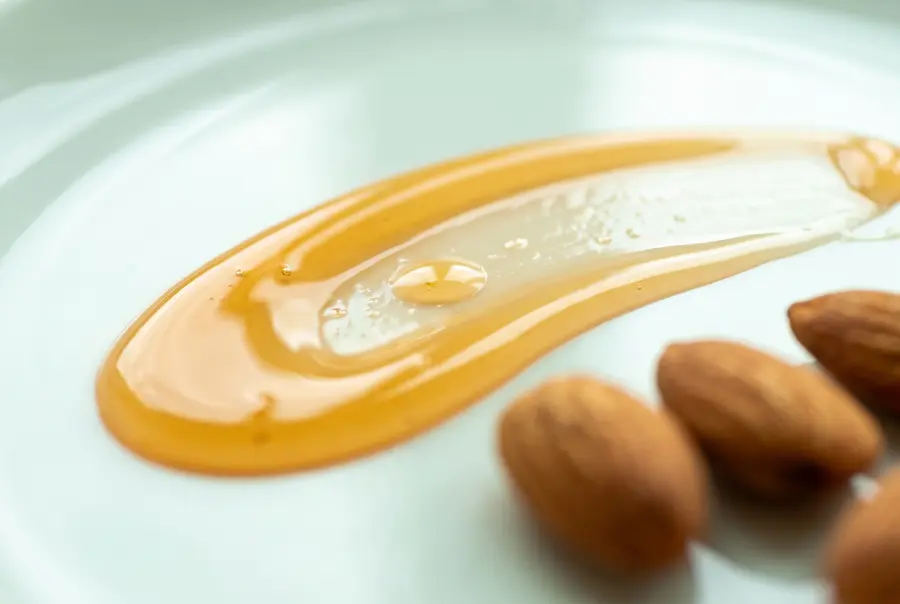 Close-up of argan and sweet almond body oil by the liter texture