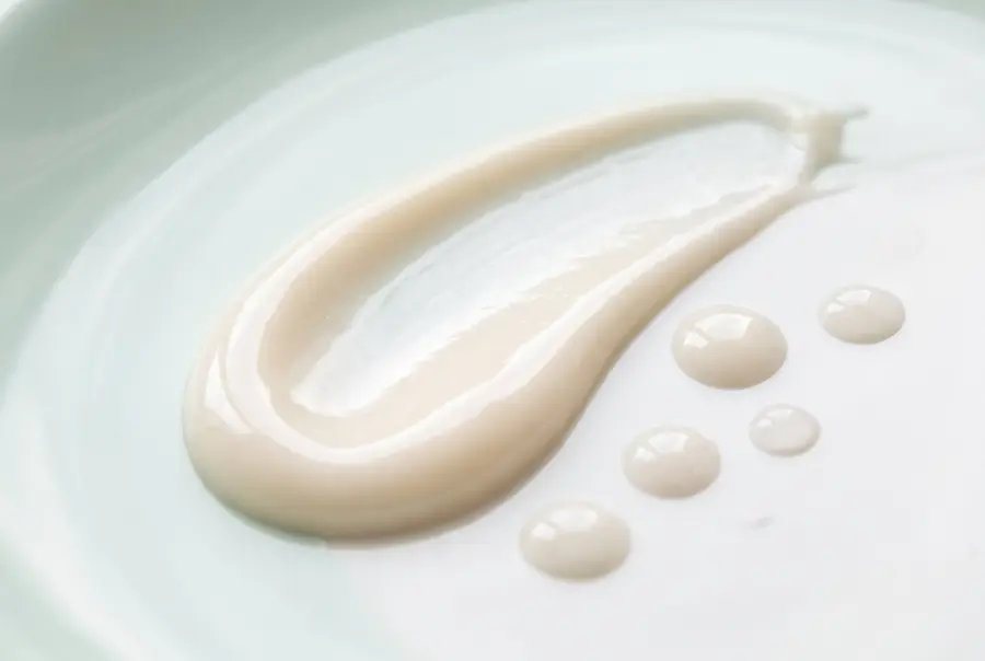 Close-up of kojic acid dark spot body lotion texture